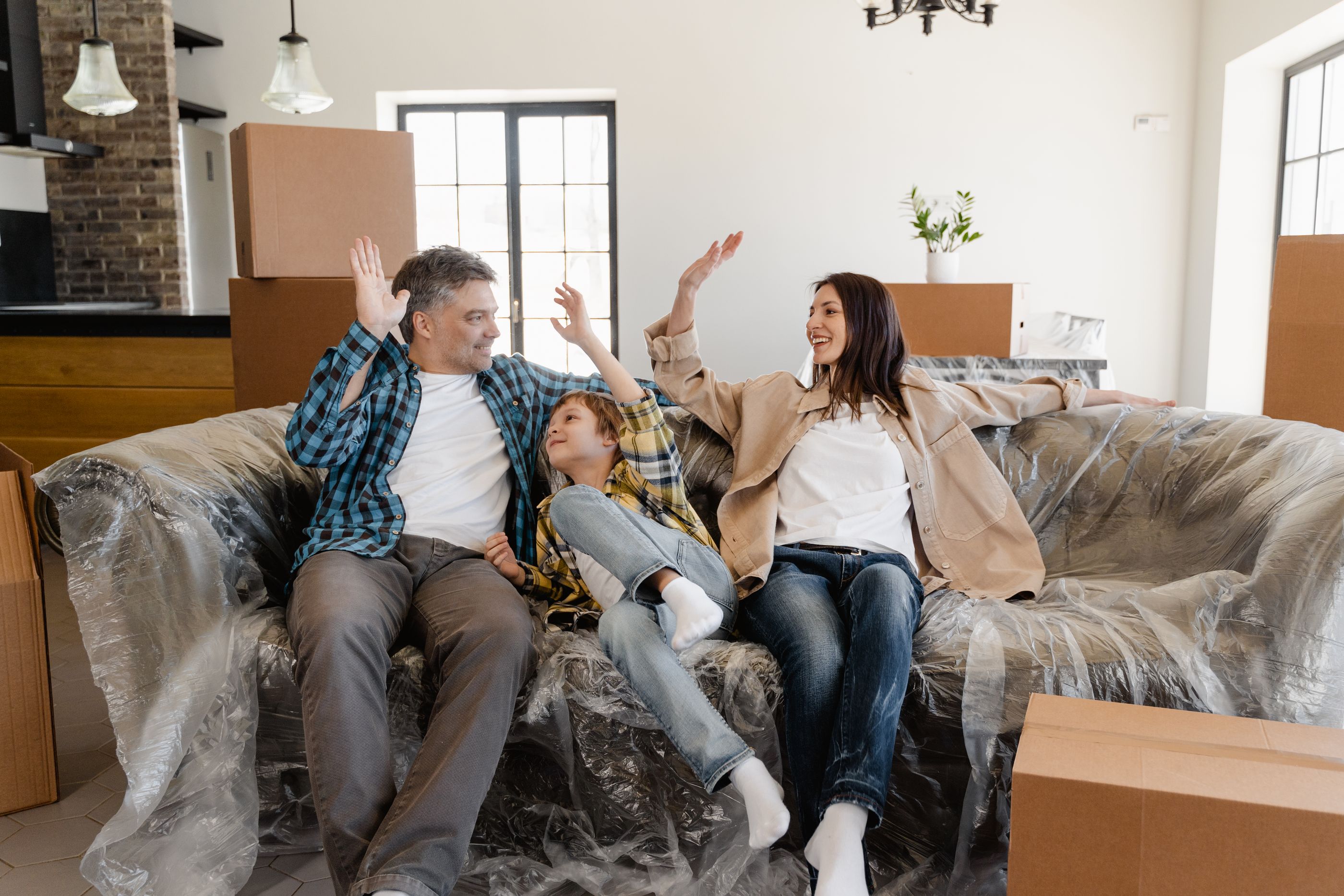 A family in their new home on moving day